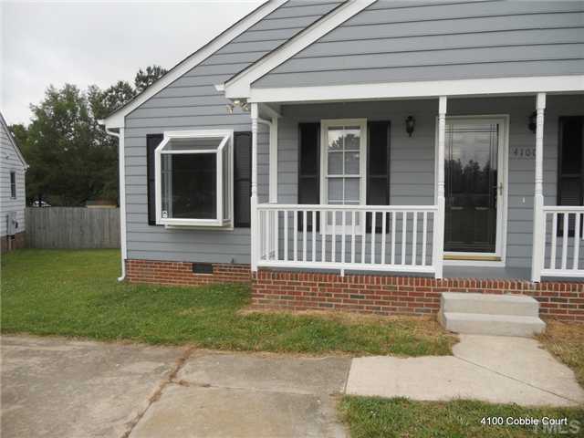 4100 Cobble Court Raleigh, NC 27616 - Photo 3 of 21 front view of a house with a yard