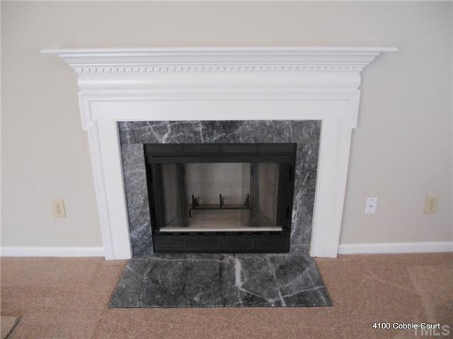4100 Cobble Court Raleigh, NC 27616 - Photo 9 of 21 a living room with a fireplace
