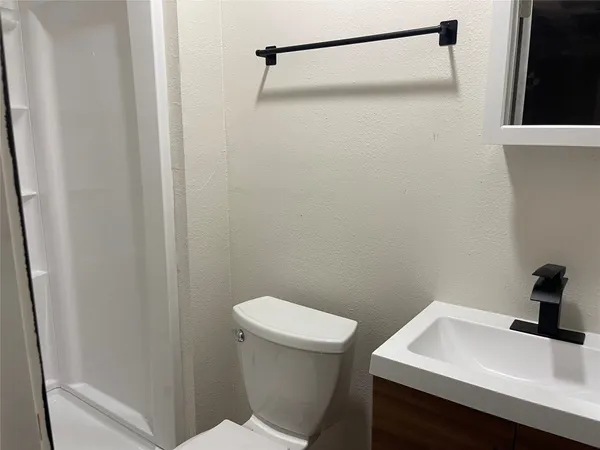 a bathroom with a sink and a toilet