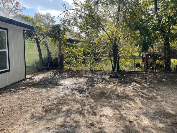 a view of house with a yard