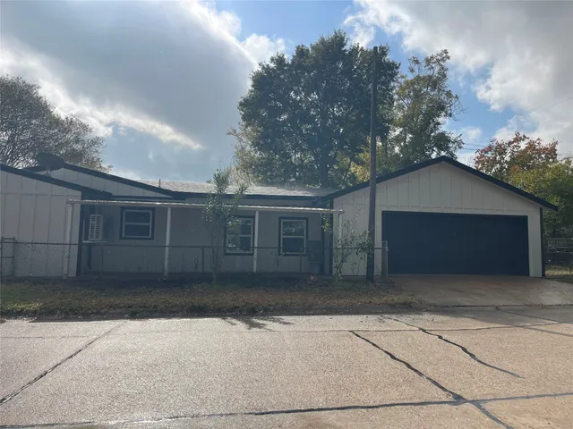 a house with trees in the background