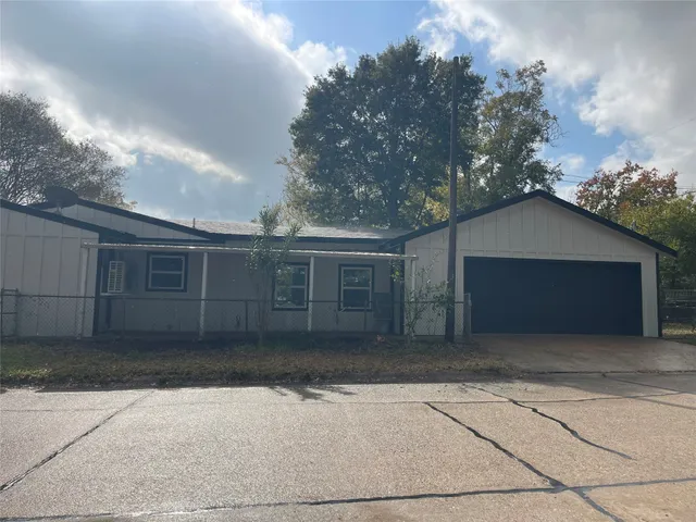 a house with trees in the background