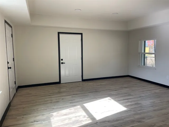 a view of an empty room and window