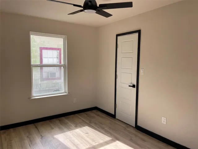 a view of an empty room and window