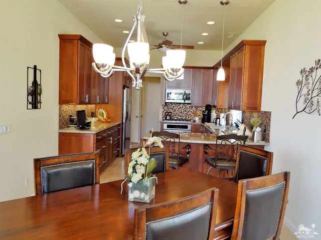 a kitchen with a table and chairs