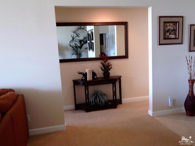 a view of room with window and furniture