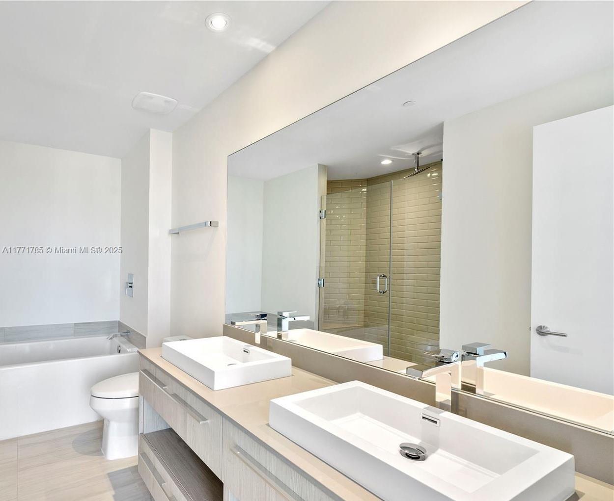 4010 South Ocean Drive, Unit T4301 Hollywood, FL 33019 - Photo 7 of 10 a bathroom with a sink and a mirror