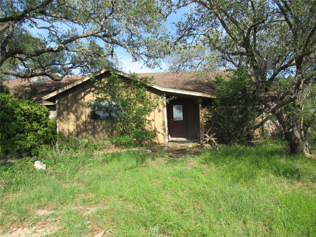 a view of a house with a tree