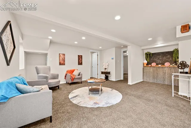 a living room with furniture and white floor