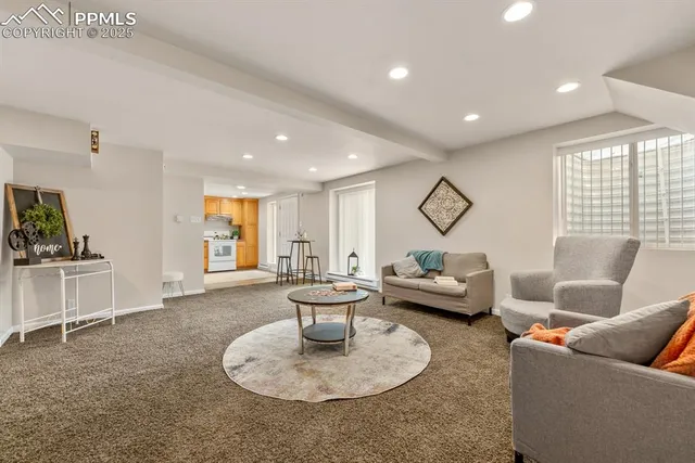 a living room with furniture and a large window