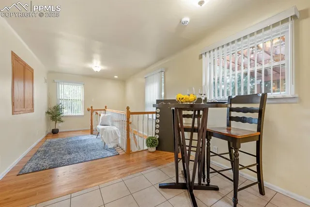 a view of a livingroom with furniture window and wooden floor