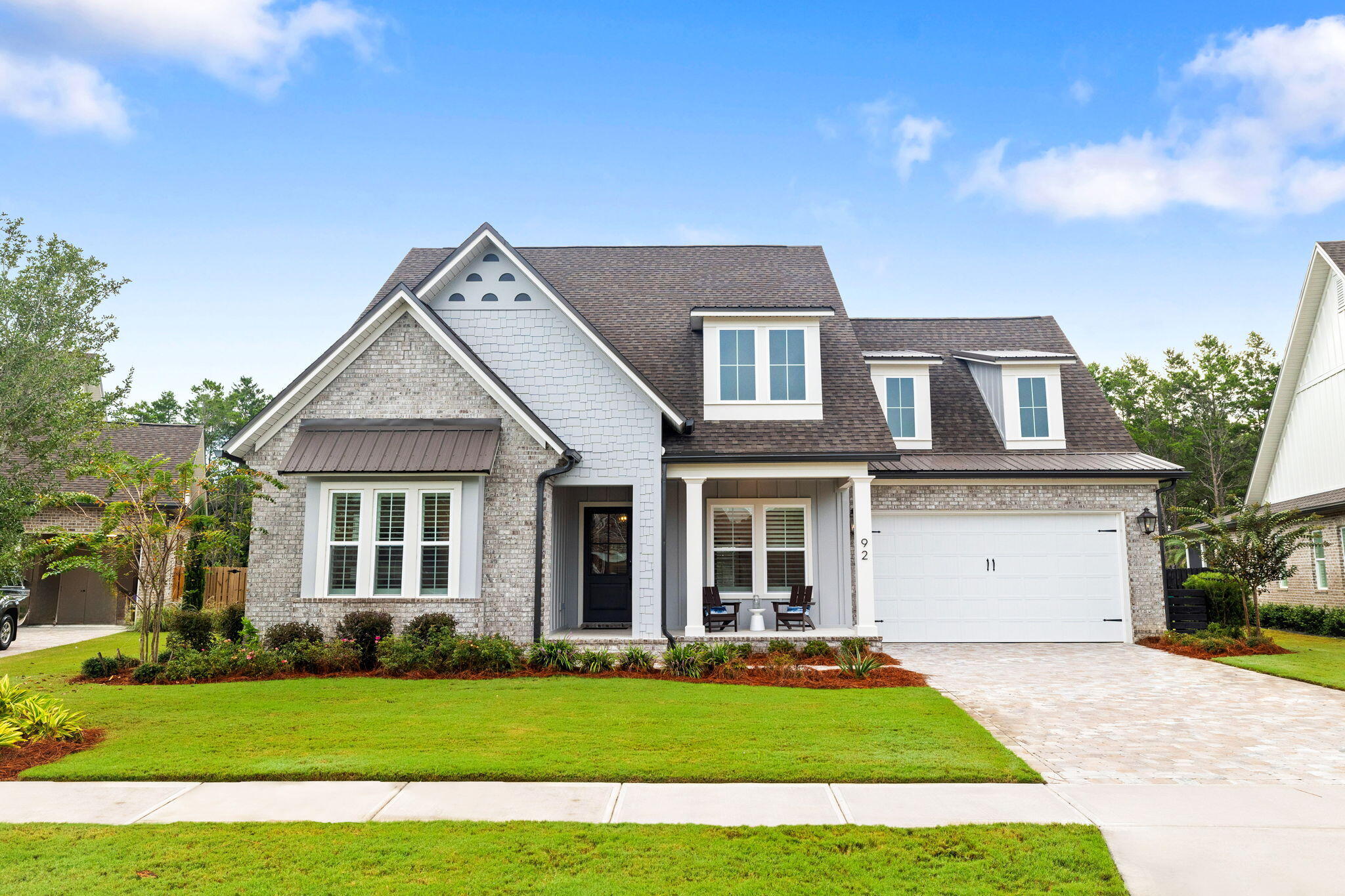 92 Revana Way Freeport, FL 32439 - Photo 9 of 59 a front view of a house with a garden