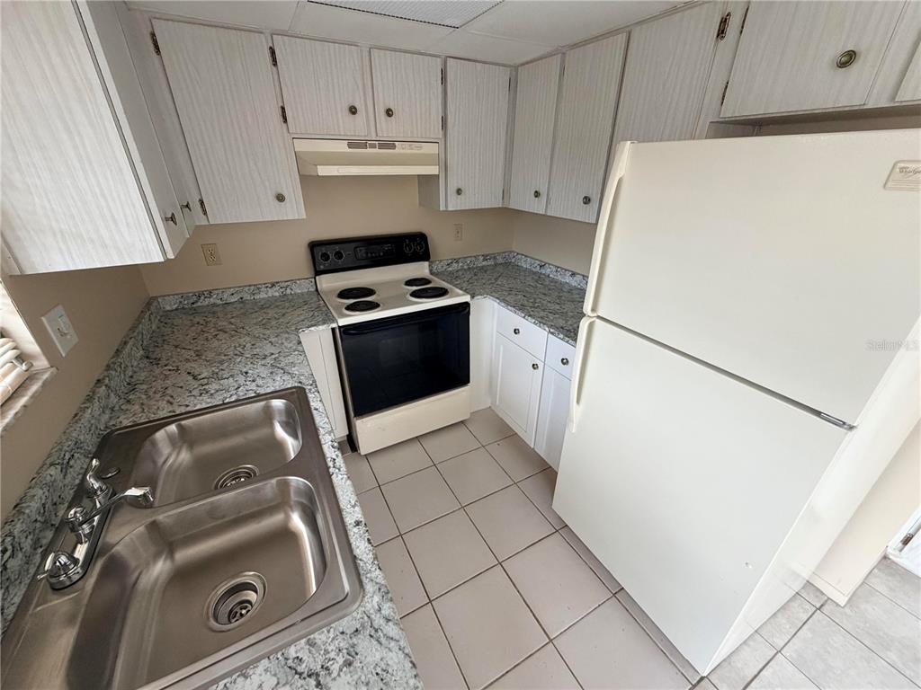 6330 Pennsylvania Avenue New Port Richey, FL 34653 - Photo 8 of 17 a kitchen with appliances and cabinets