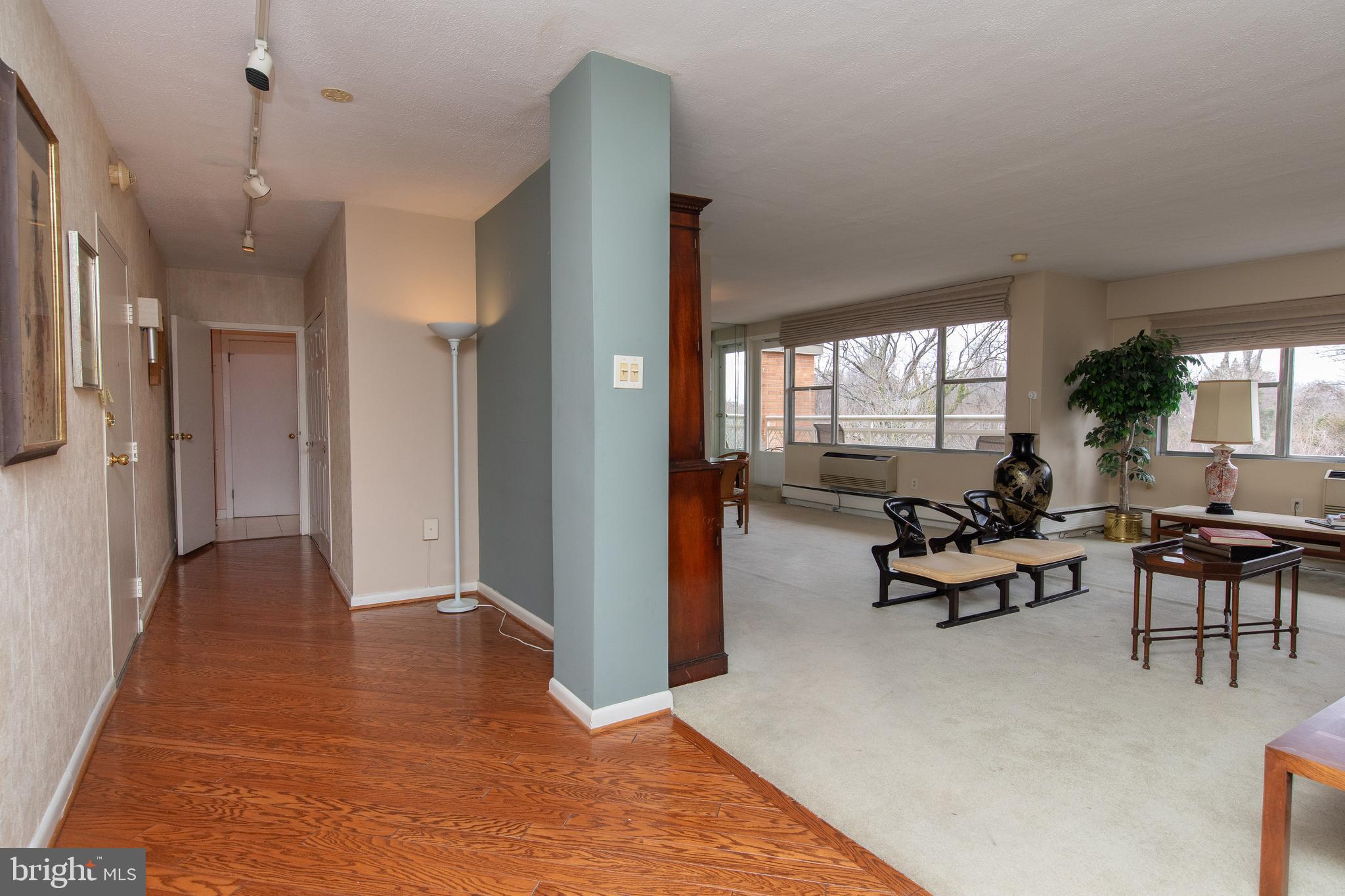 7900 Old York Road, Unit 906A Elkins Park, PA 19027 - Photo 11 of 42 a living room with furniture window and wooden floor