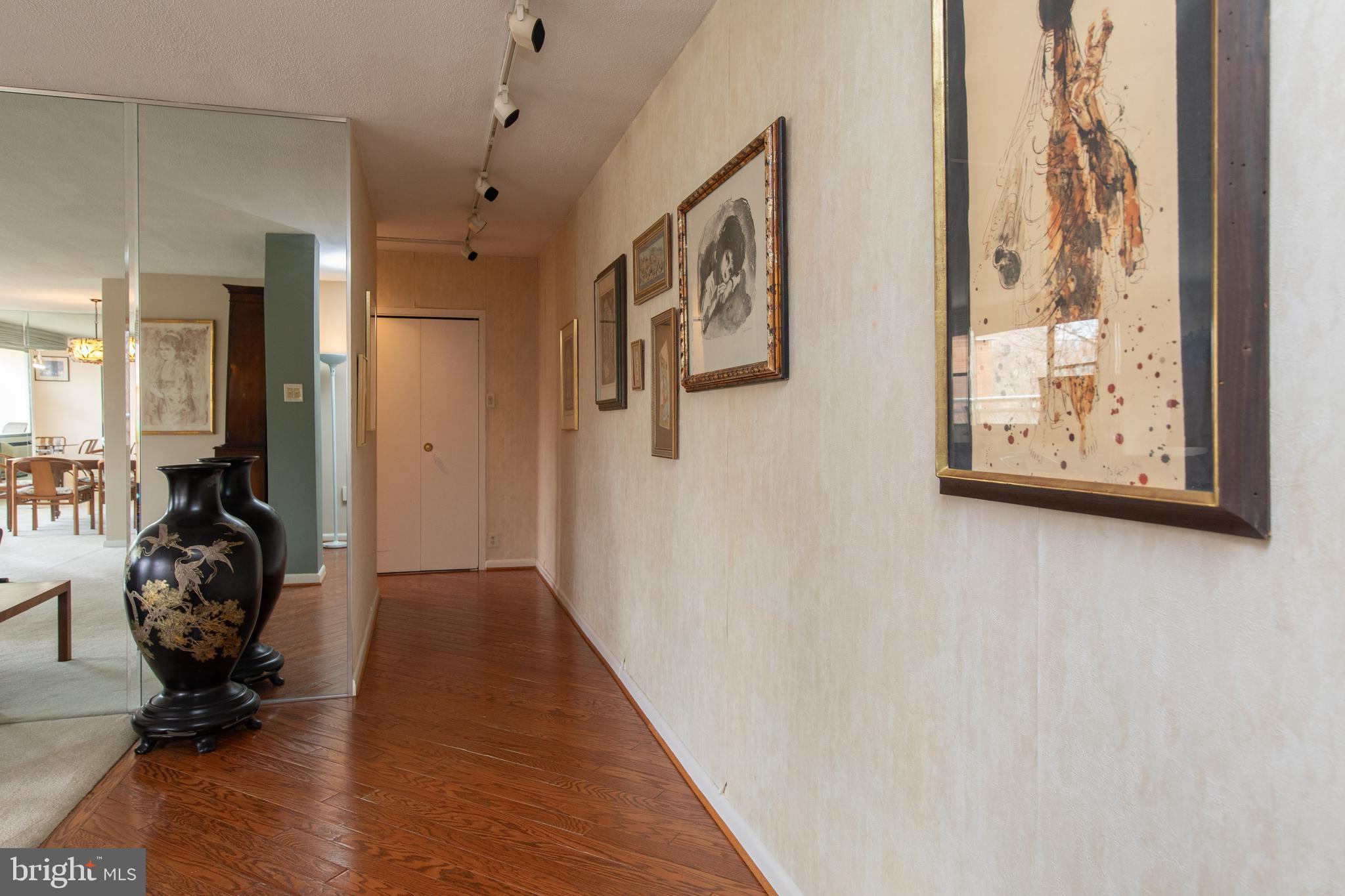 7900 Old York Road, Unit 906A Elkins Park, PA 19027 - Photo 12 of 42 a view of a hallway with elevator and mirrors