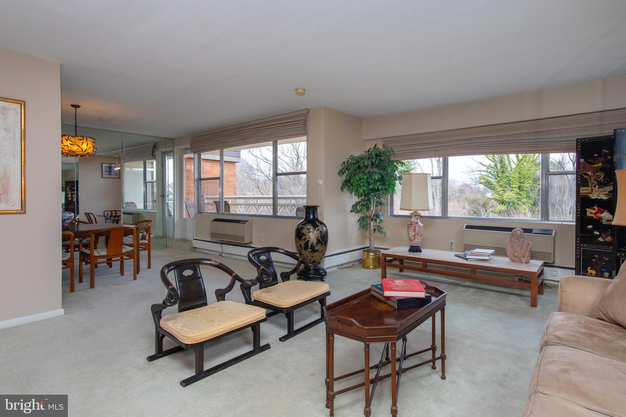 7900 Old York Road, Unit 906A Elkins Park, PA 19027 - Photo 13 of 42 a living room with furniture and a large window