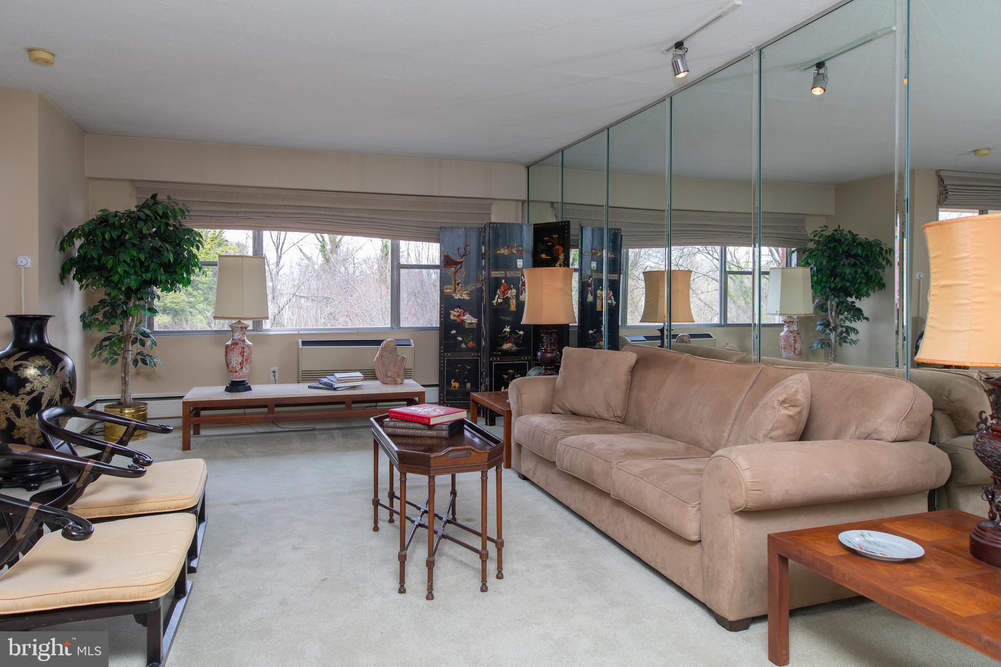 7900 Old York Road, Unit 906A Elkins Park, PA 19027 - Photo 15 of 42 a living room with furniture and a large window