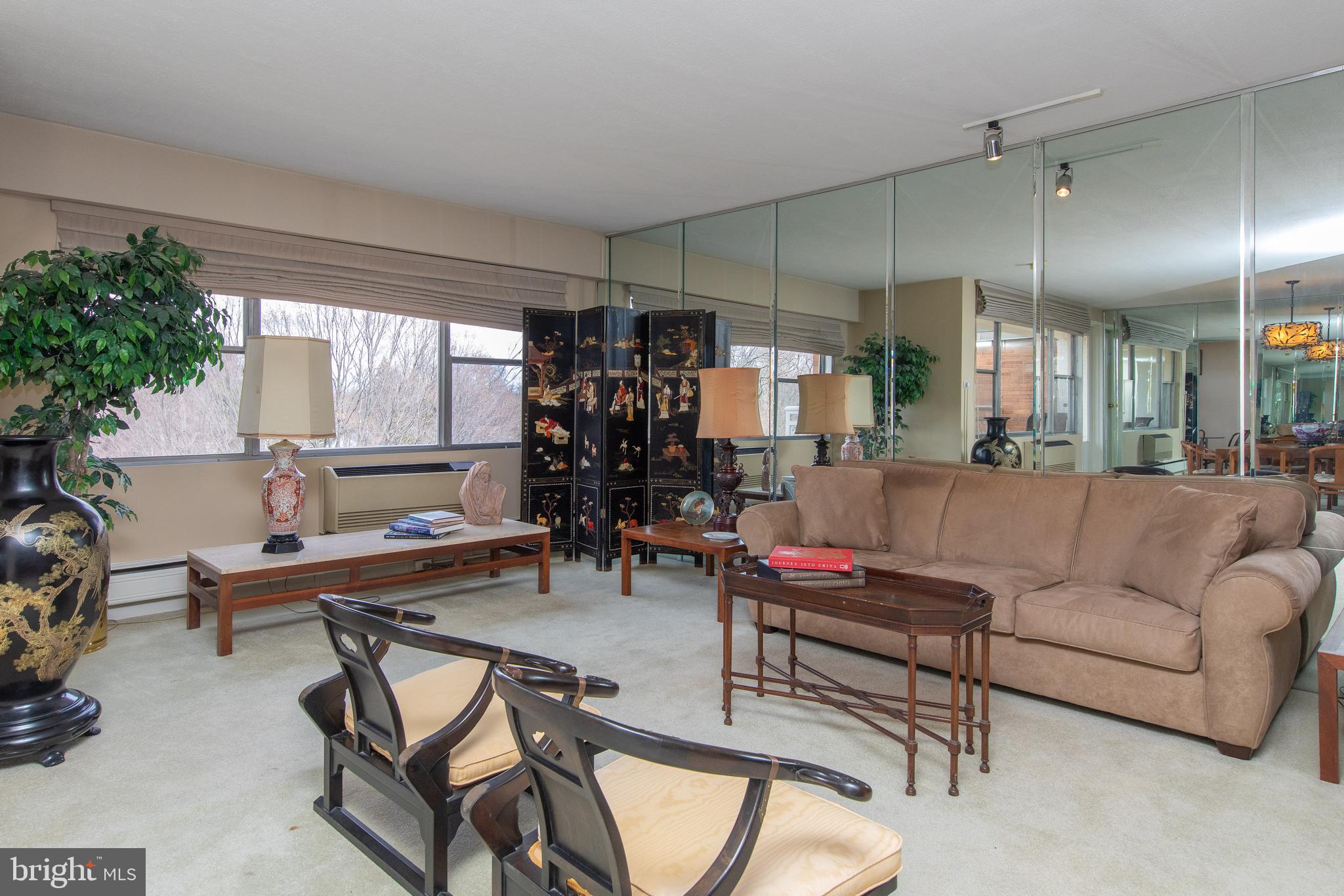 7900 Old York Road, Unit 906A Elkins Park, PA 19027 - Photo 16 of 42 a living room with furniture and a large window