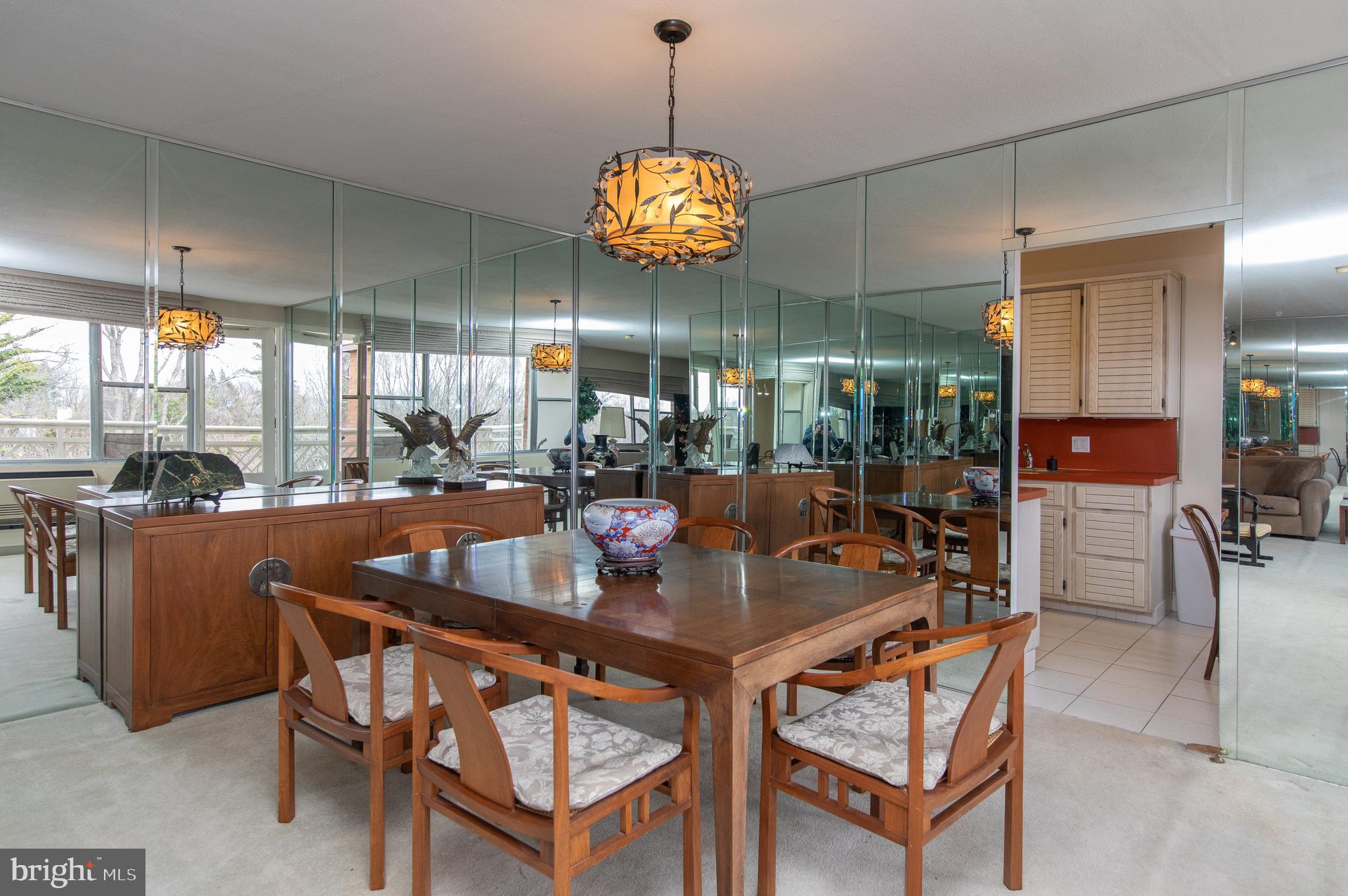 7900 Old York Road, Unit 906A Elkins Park, PA 19027 - Photo 18 of 42 a dining area with a table and chairs
