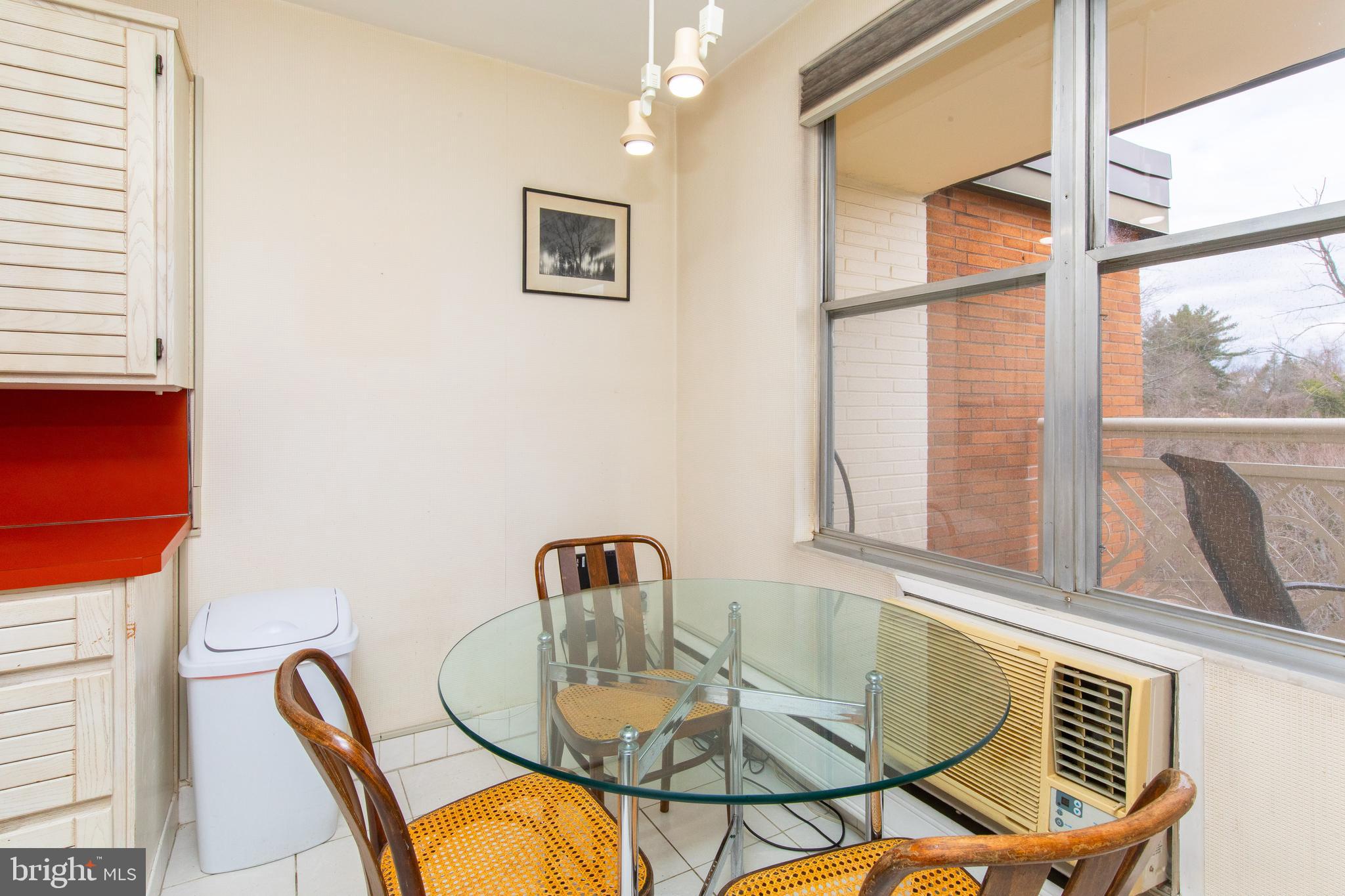 7900 Old York Road, Unit 906A Elkins Park, PA 19027 - Photo 23 of 42 a dining room with furniture and window