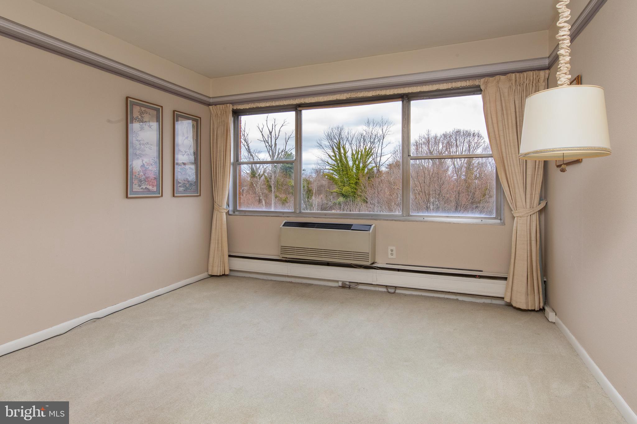 7900 Old York Road, Unit 906A Elkins Park, PA 19027 - Photo 26 of 42 an empty room with windows and view