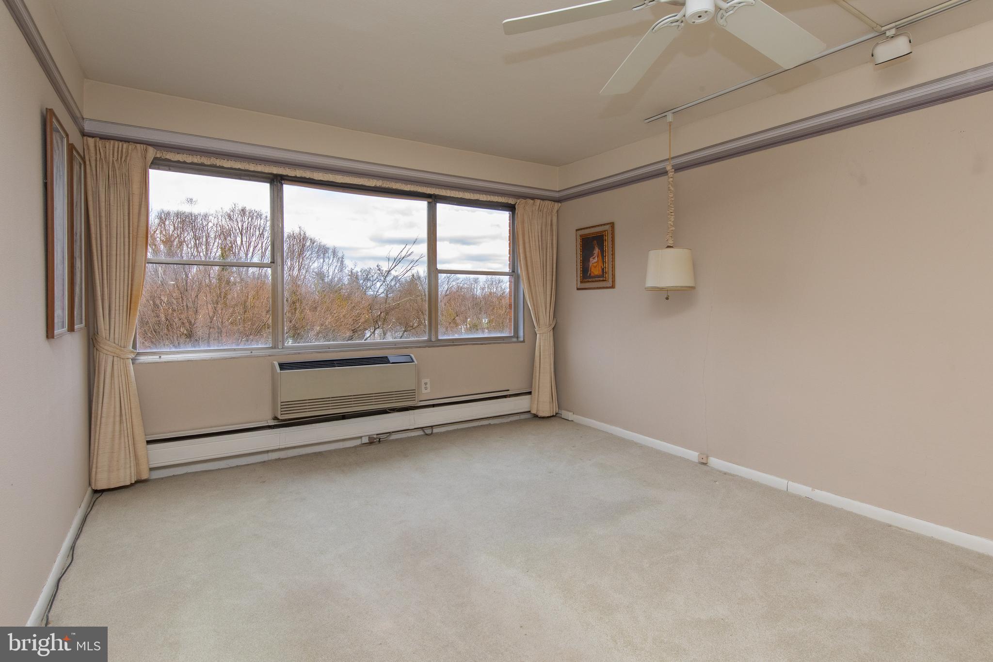 7900 Old York Road, Unit 906A Elkins Park, PA 19027 - Photo 27 of 42 a view of an empty room with a window
