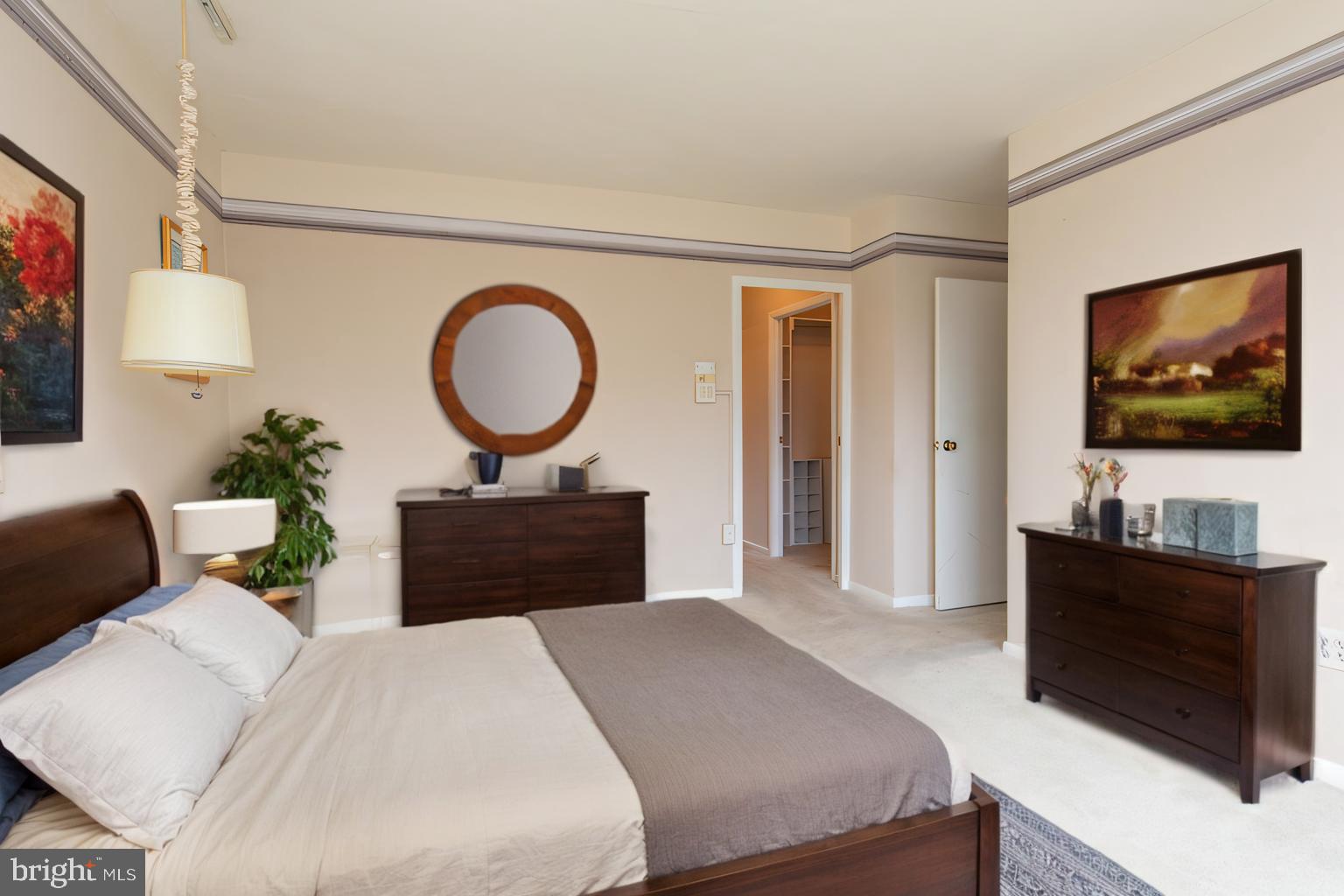 7900 Old York Road, Unit 906A Elkins Park, PA 19027 - Photo 28 of 42 a bedroom with a bed and a flat screen tv
