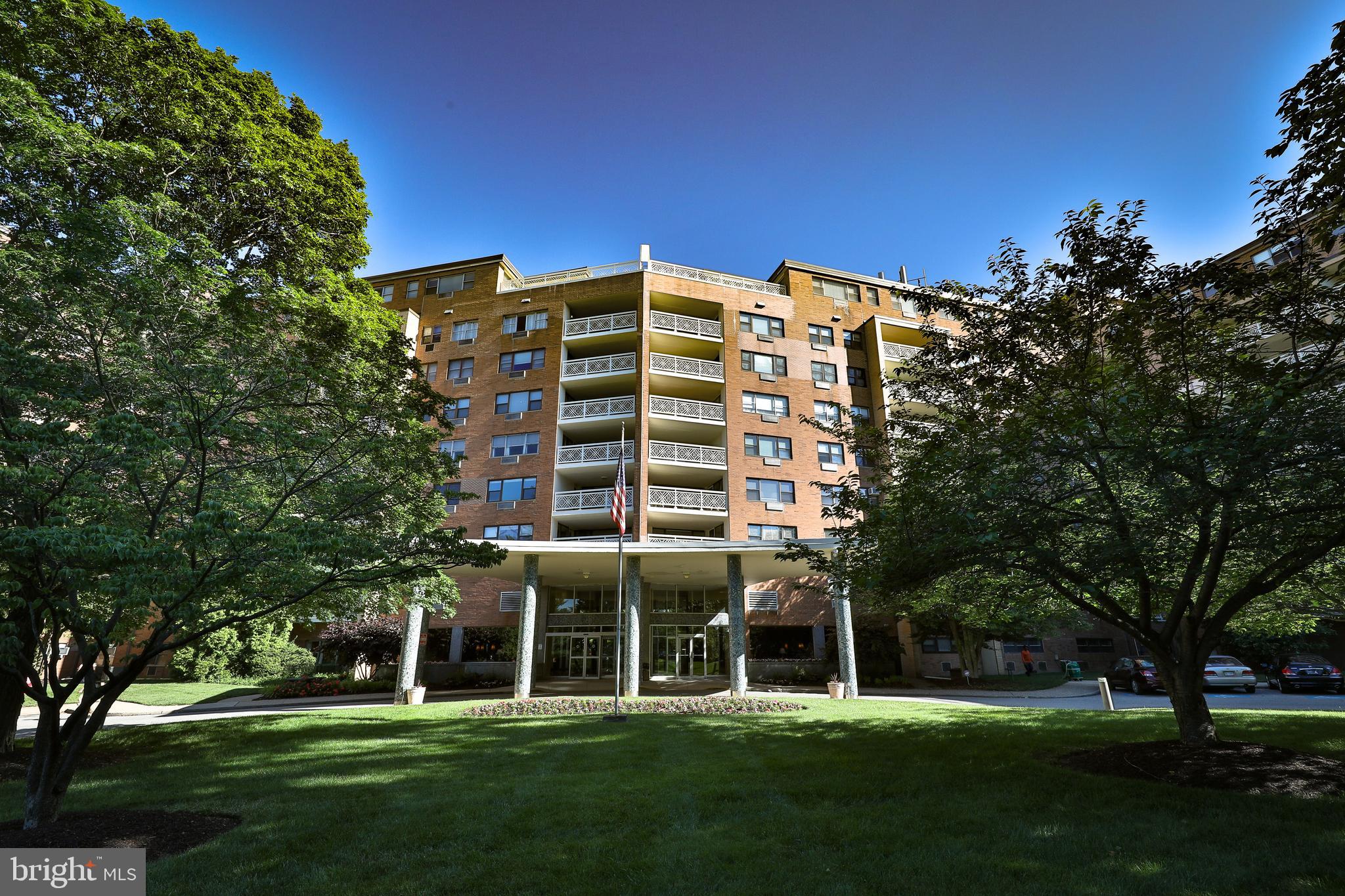 7900 Old York Road, Unit 906A Elkins Park, PA 19027 - Photo 3 of 42 a front view of a building with a garden