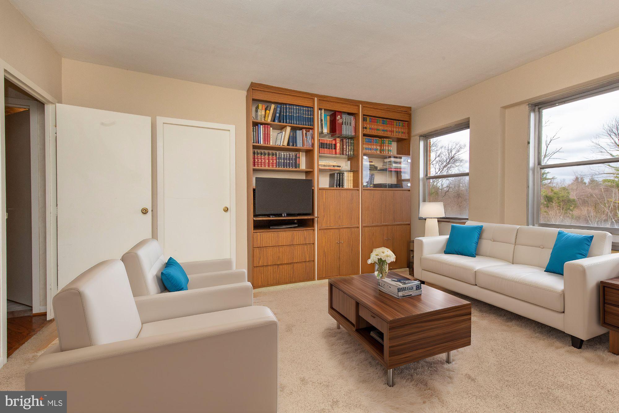 7900 Old York Road, Unit 906A Elkins Park, PA 19027 - Photo 33 of 42 a living room with furniture and a potted plant