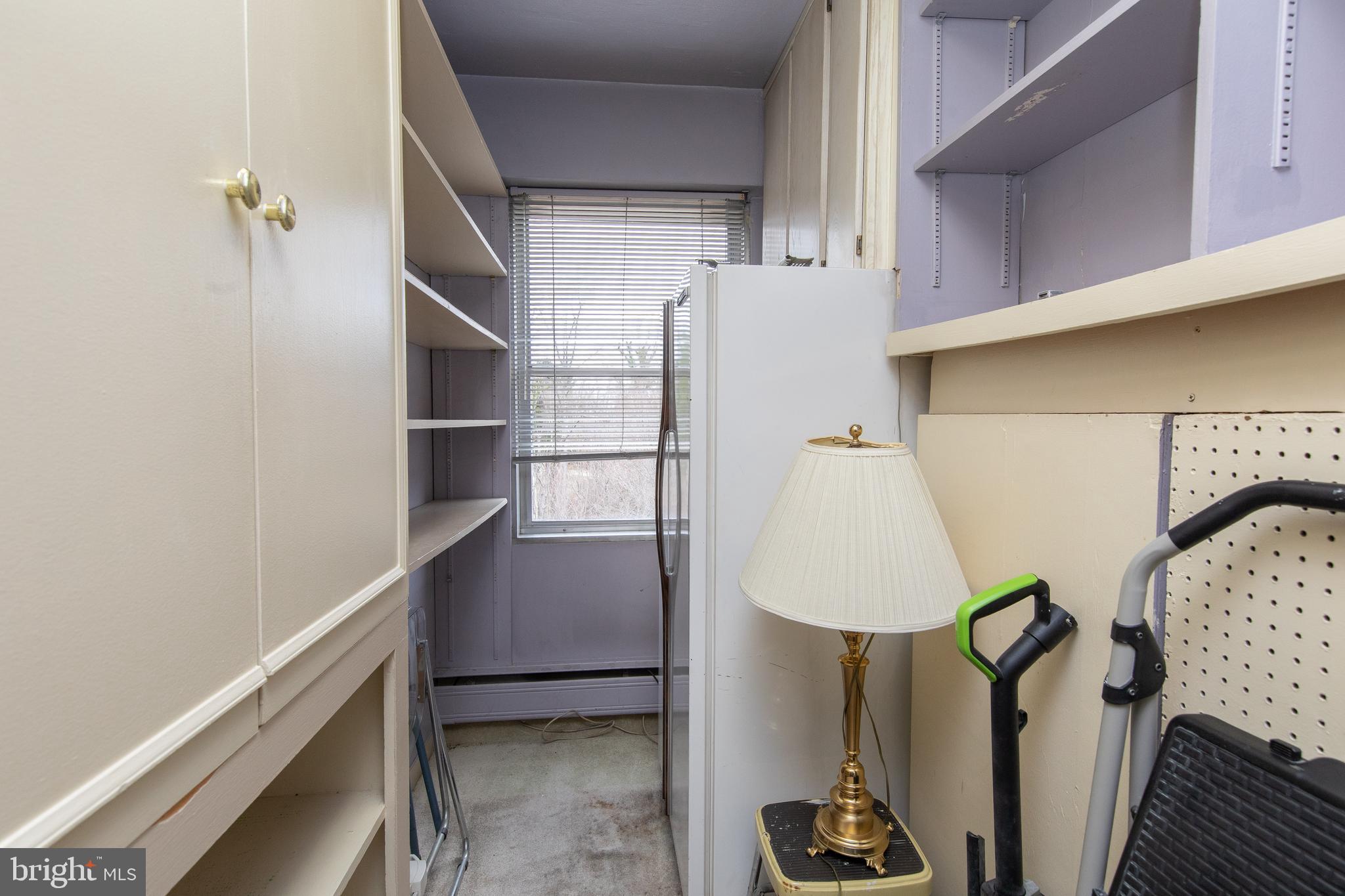 7900 Old York Road, Unit 906A Elkins Park, PA 19027 - Photo 35 of 42 a view of walk in closet with clothes