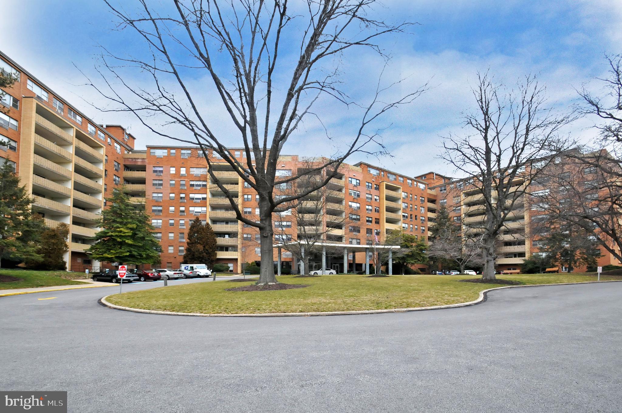 7900 Old York Road, Unit 906A Elkins Park, PA 19027 - Photo 4 of 42 a view of building with yard and trees