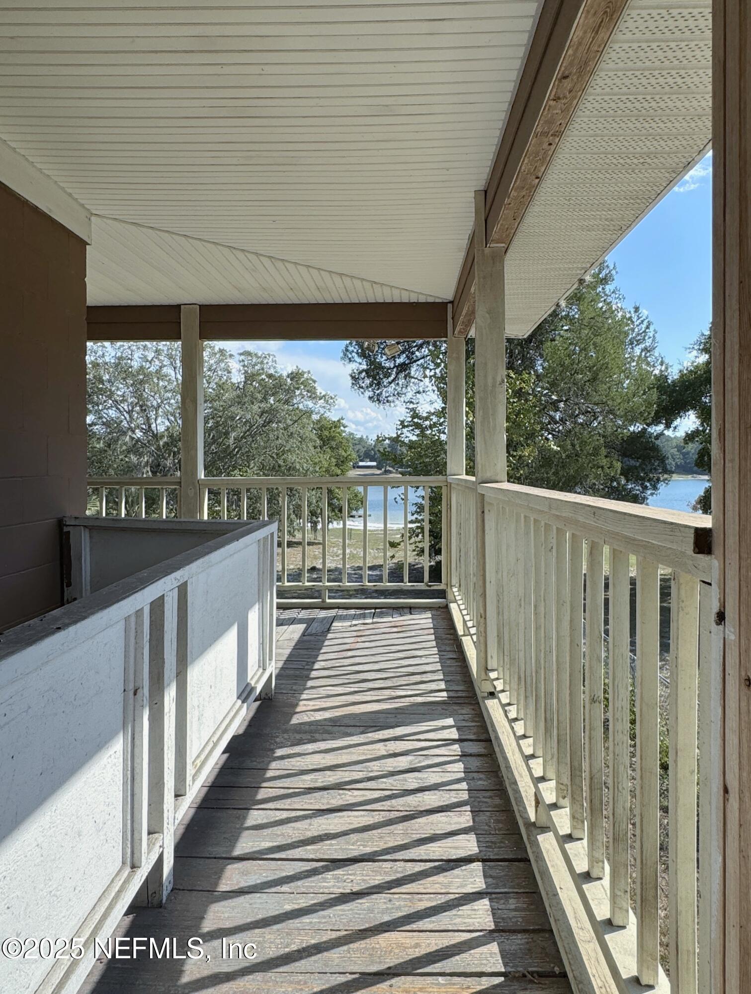 5756 Southeast 55th Terrace Keystone Heights, FL 32656 - Photo 18 of 35 a view of a balcony with wooden floor
