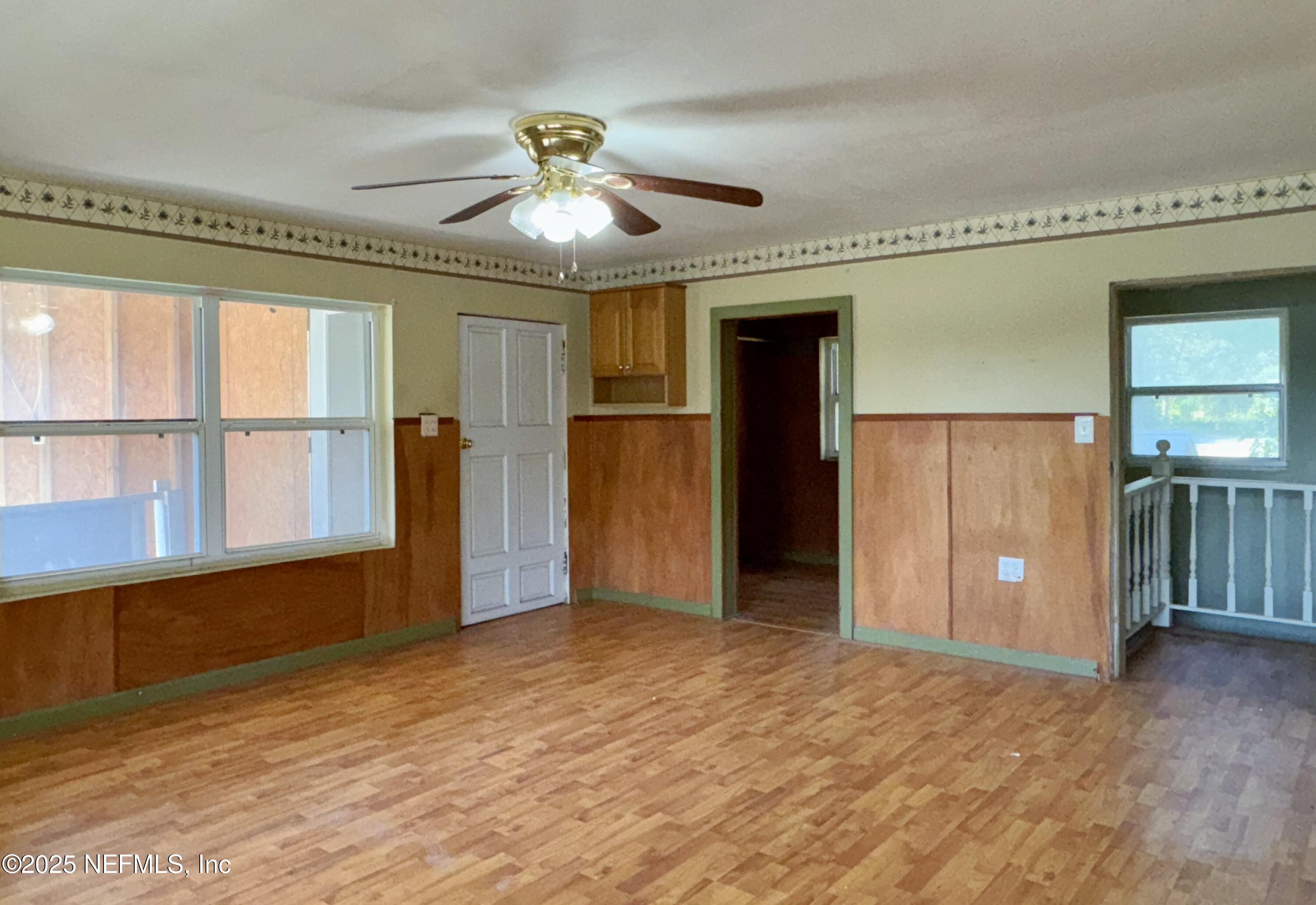 5756 Southeast 55th Terrace Keystone Heights, FL 32656 - Photo 24 of 35 an empty room with closet and windows