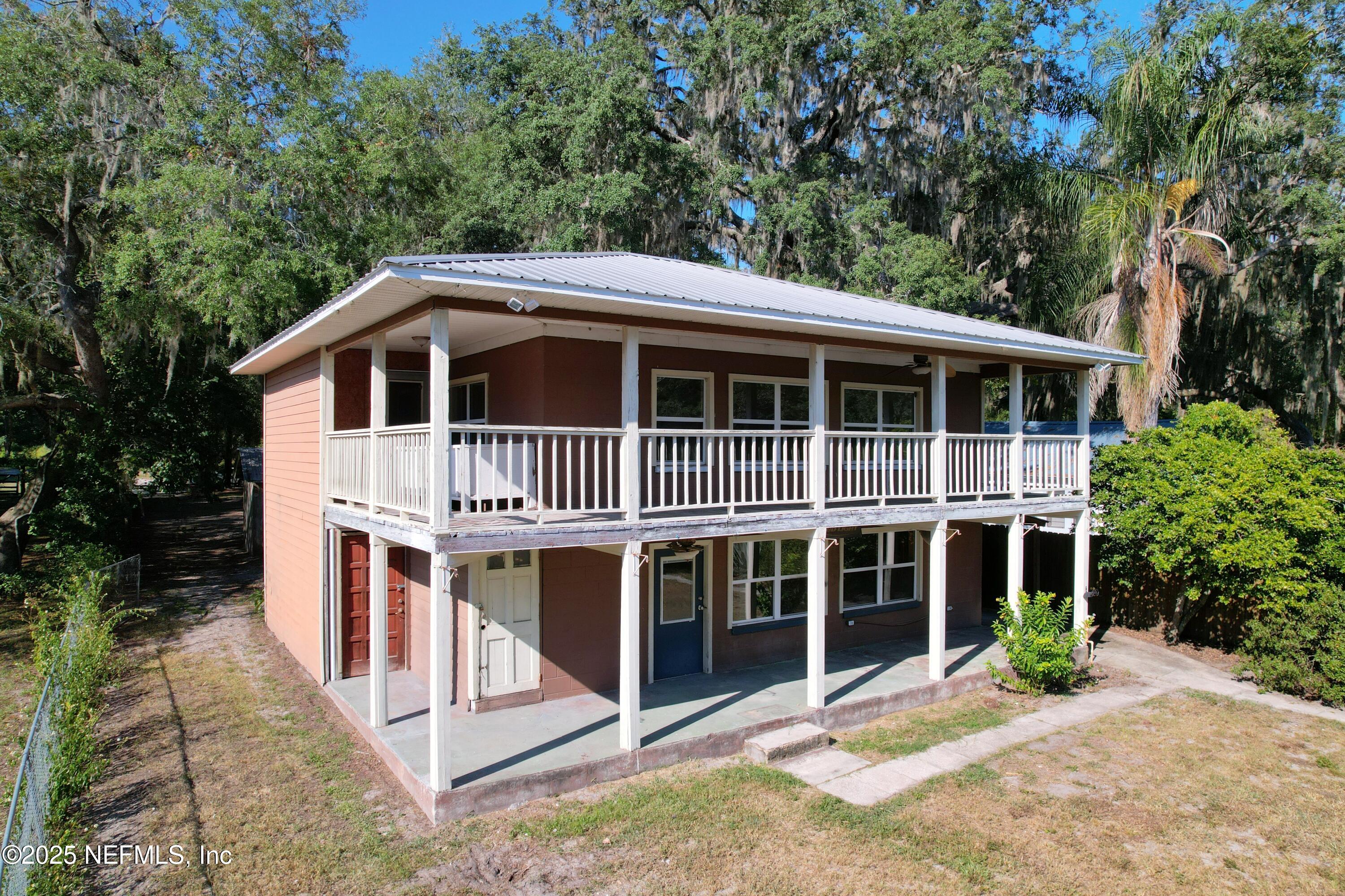 5756 Southeast 55th Terrace Keystone Heights, FL 32656 - Photo 29 of 35 a front view of a house with a porch