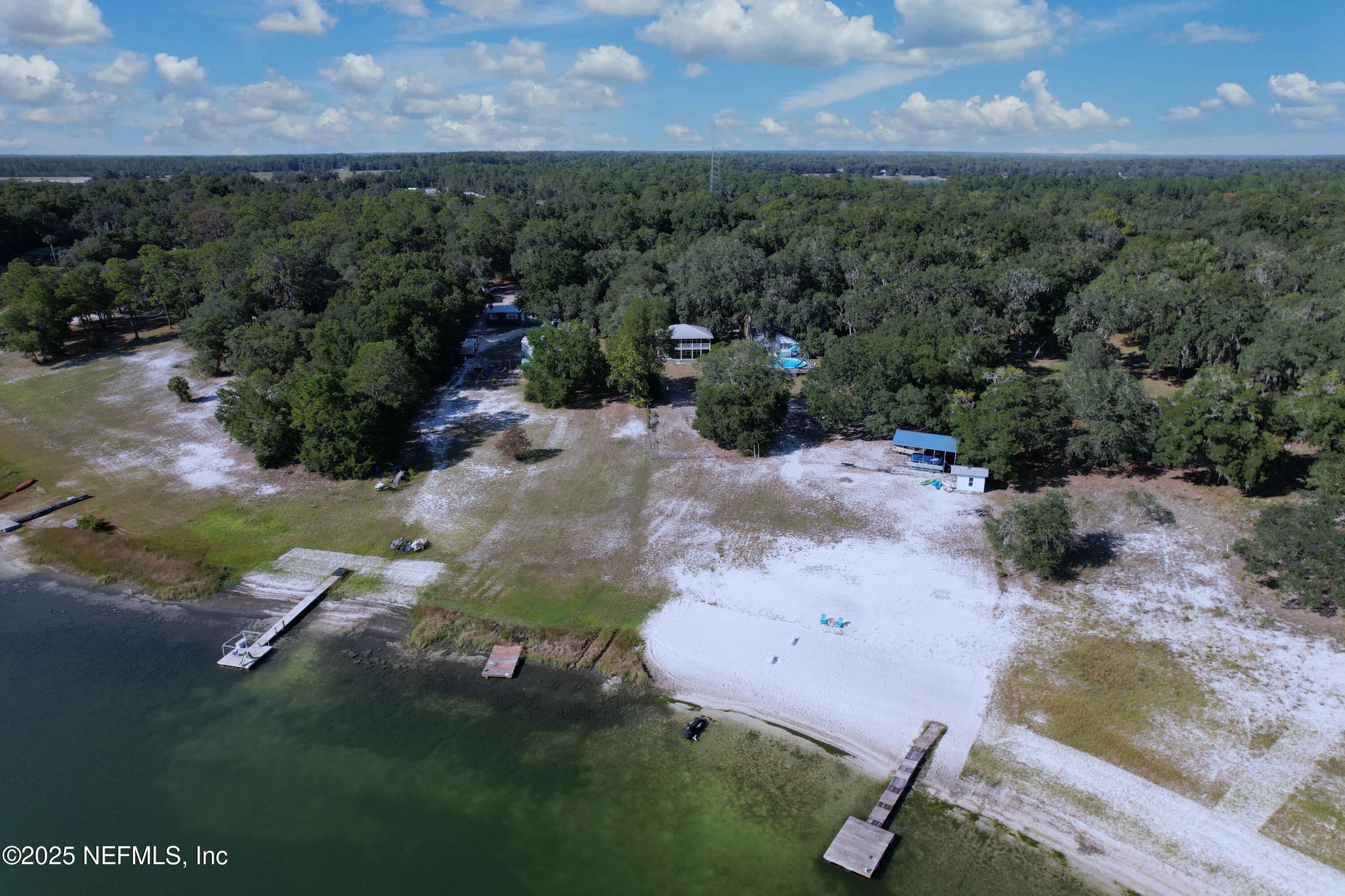 5756 Southeast 55th Terrace Keystone Heights, FL 32656 - Photo 34 of 35 an aerial view of a house with a yard