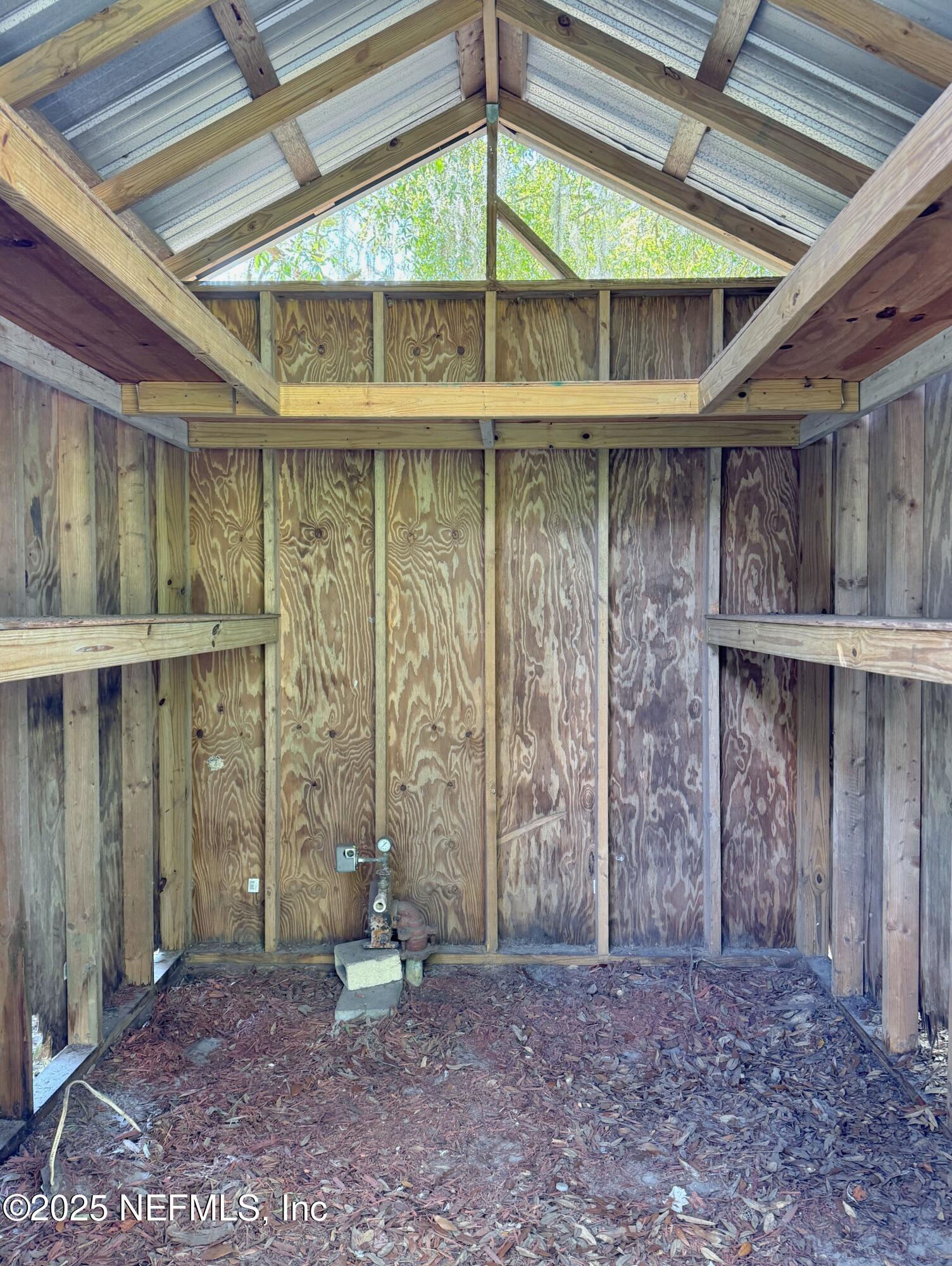 5756 Southeast 55th Terrace Keystone Heights, FL 32656 - Photo 4 of 35 a backyard of a house with a table and chairs