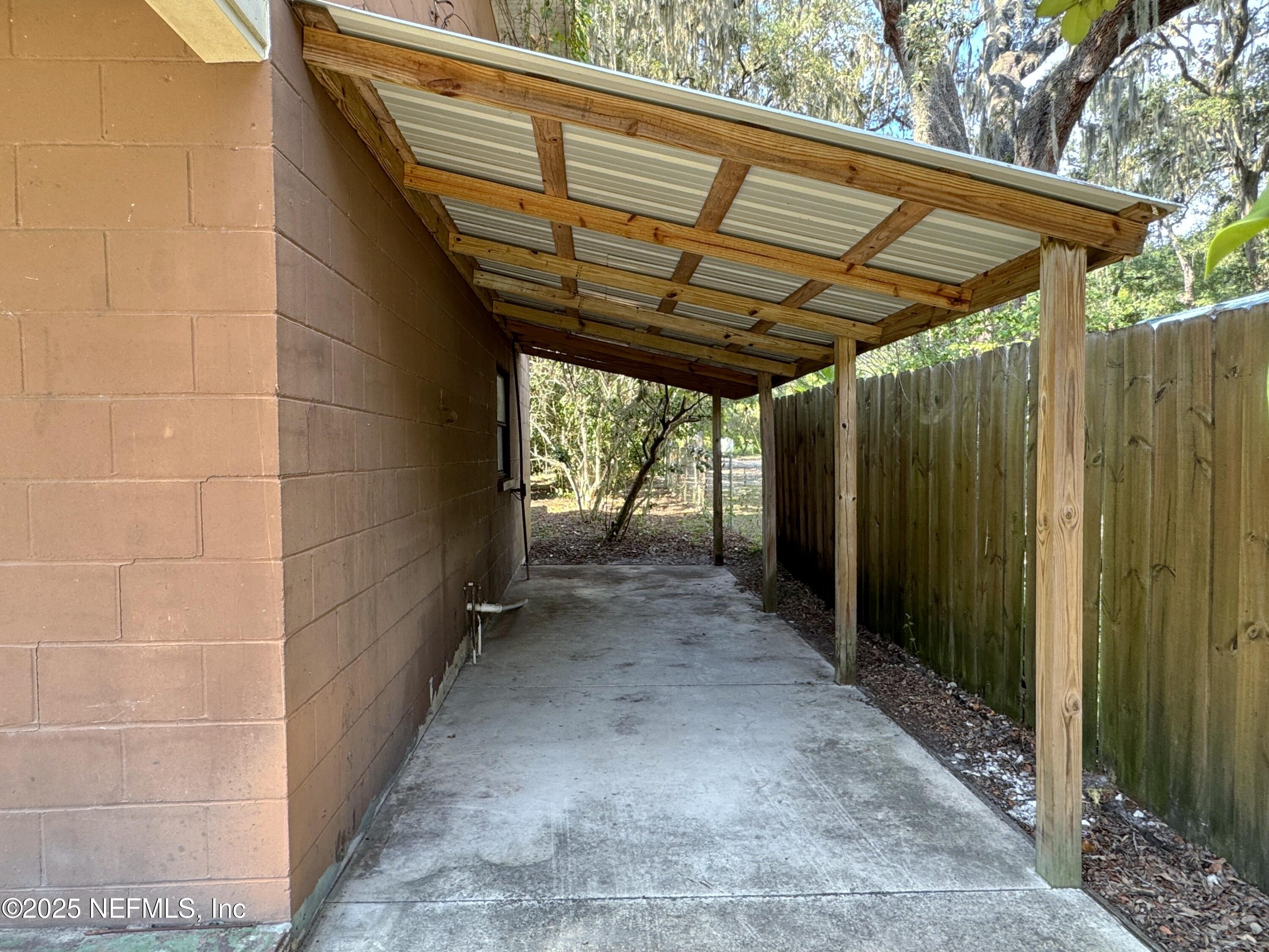 5756 Southeast 55th Terrace Keystone Heights, FL 32656 - Photo 5 of 35 a view of a room with wooden walls and roof