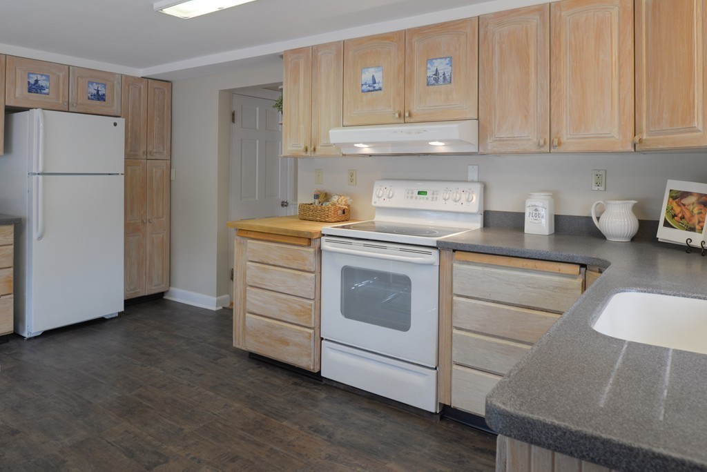 8 Puritan Road Marblehead, MA 01945 - Photo 18 of 25 a kitchen with cabinets appliances a sink and a counter top space