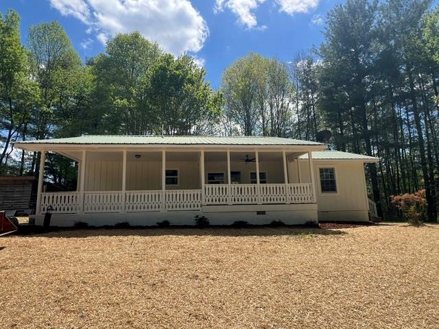 1616 Abe Cove Road Hiawassee, GA 30546 - Photo 3 of 17 a front view of a house with a yard