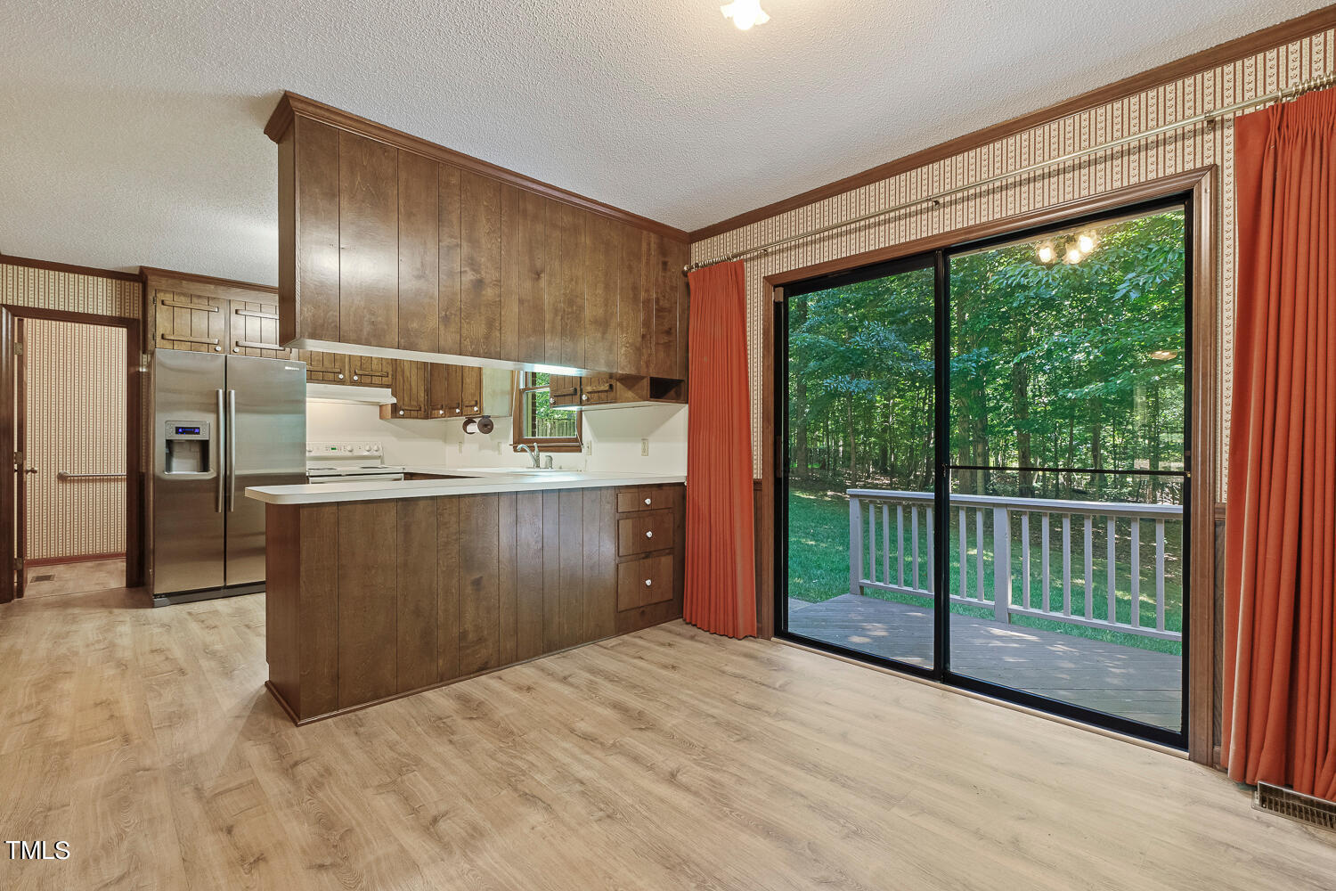 6013 Splitrock Trail Apex, NC 27539 - Photo 19 of 53 a kitchen with kitchen island a sink stove and refrigerator