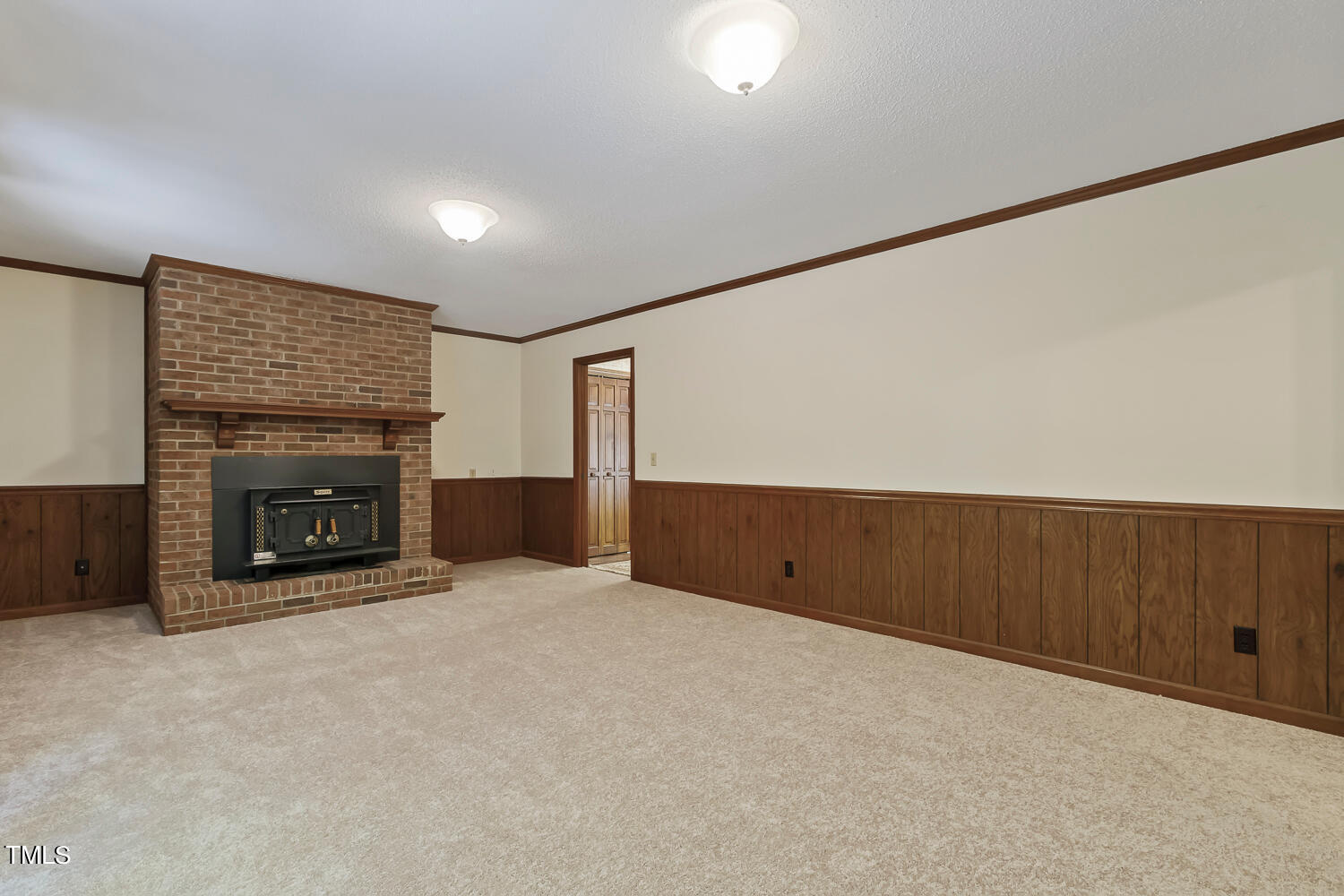 6013 Splitrock Trail Apex, NC 27539 - Photo 26 of 53 a view of an empty room with a fireplace