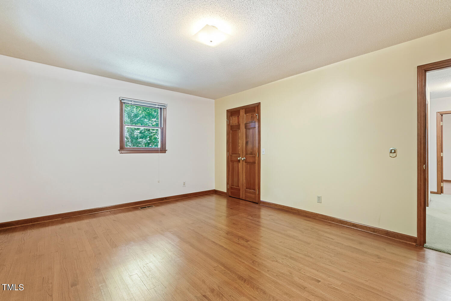 6013 Splitrock Trail Apex, NC 27539 - Photo 31 of 53 an empty room with wooden floor and window
