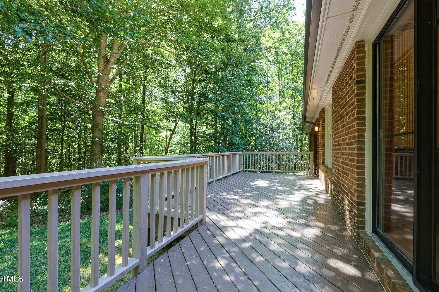 6013 Splitrock Trail Apex, NC 27539 - Photo 45 of 53 a view of backyard with deck and wooden floor
