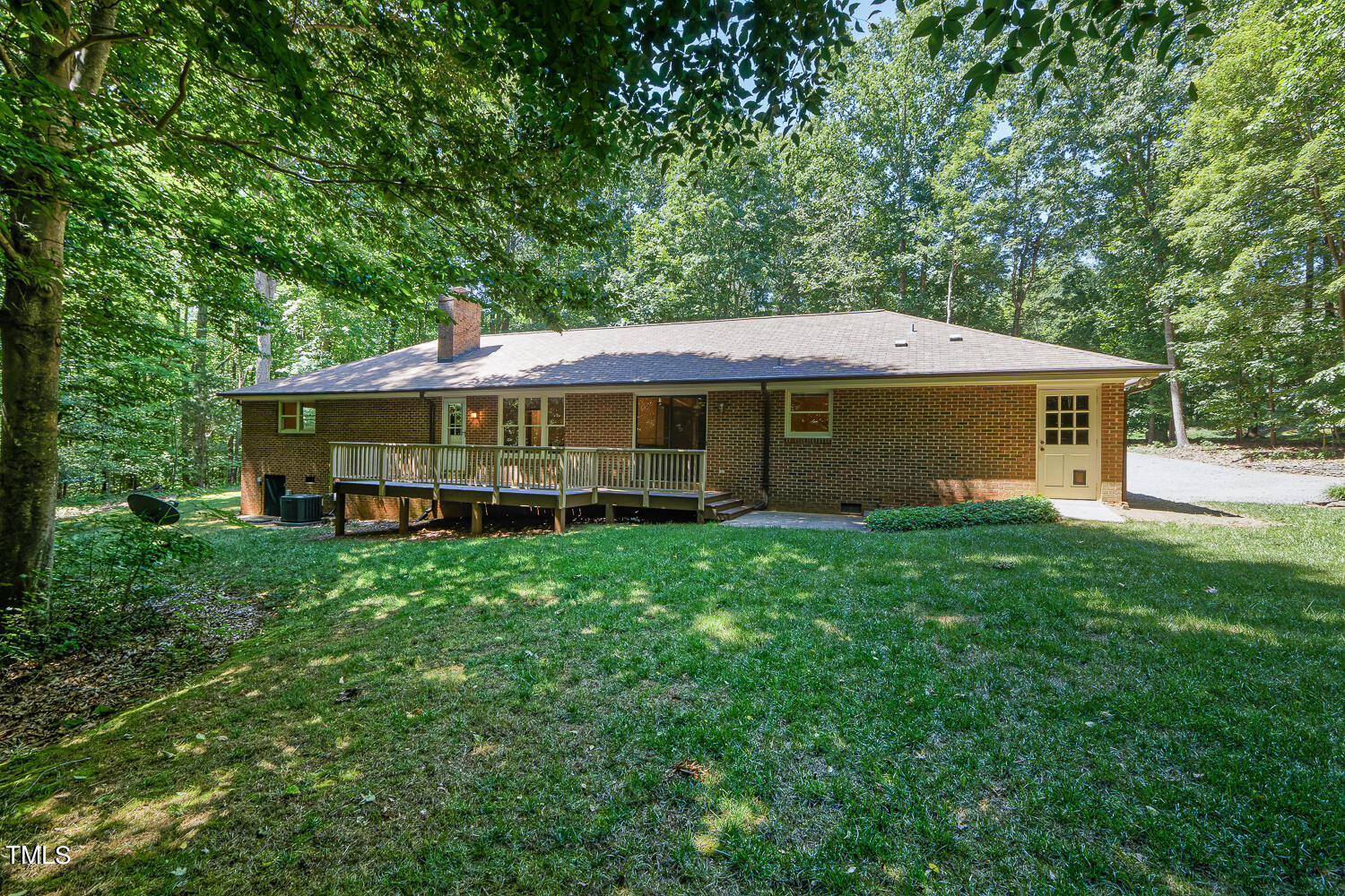 6013 Splitrock Trail Apex, NC 27539 - Photo 49 of 53 a view of a house with a yard and sitting area