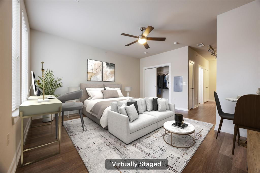 1900 Barton Springs Road, Unit 3013 Austin, TX 78704 - Photo 4 of 27 Hardwood floors and a spacious layout create a comfortable living environment in this bedroom.