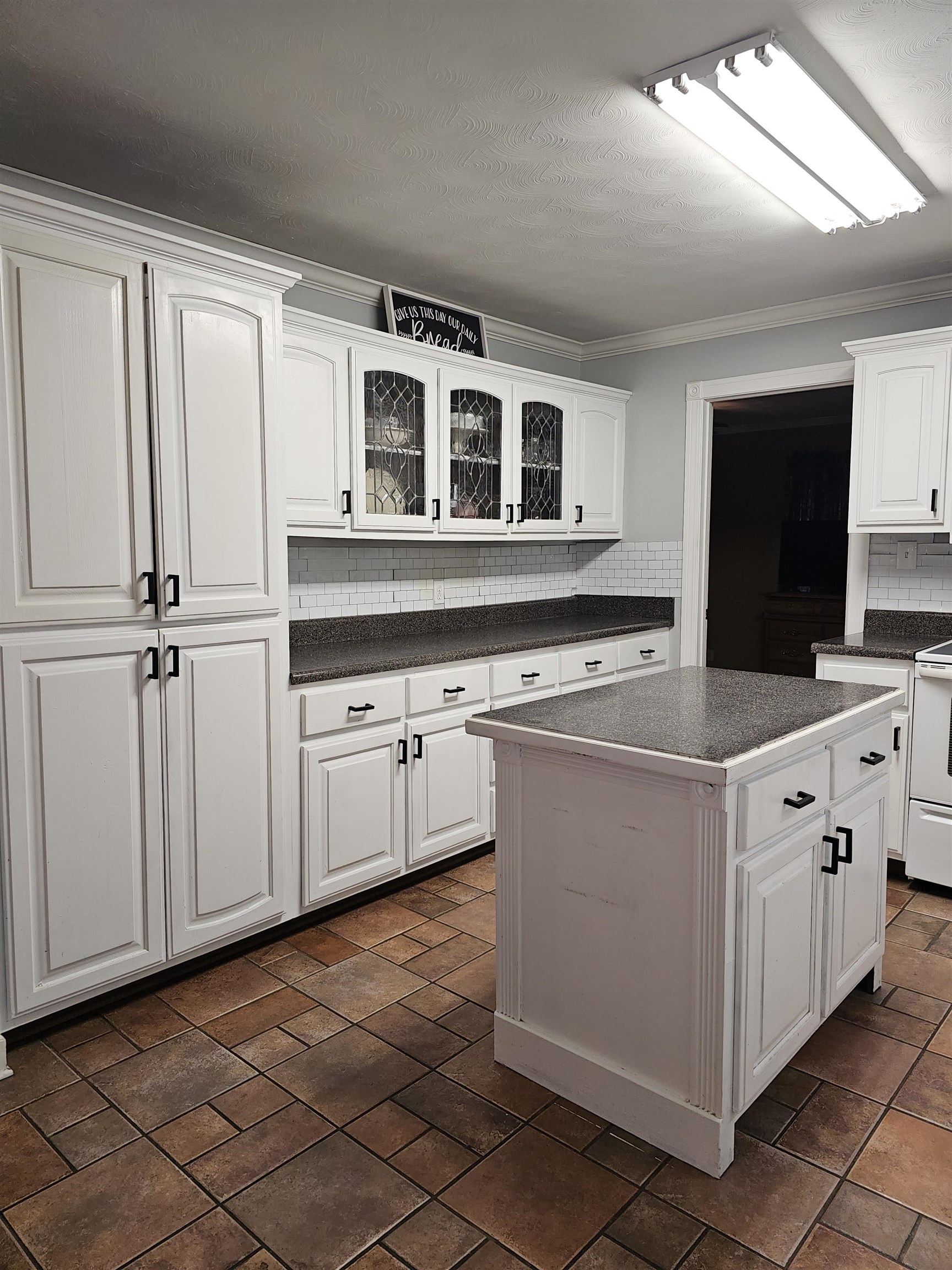 113 Smith Drive Ripley, TN 38063 - Photo 31 of 39 a kitchen with stainless steel appliances granite countertop a white stove top oven and sink