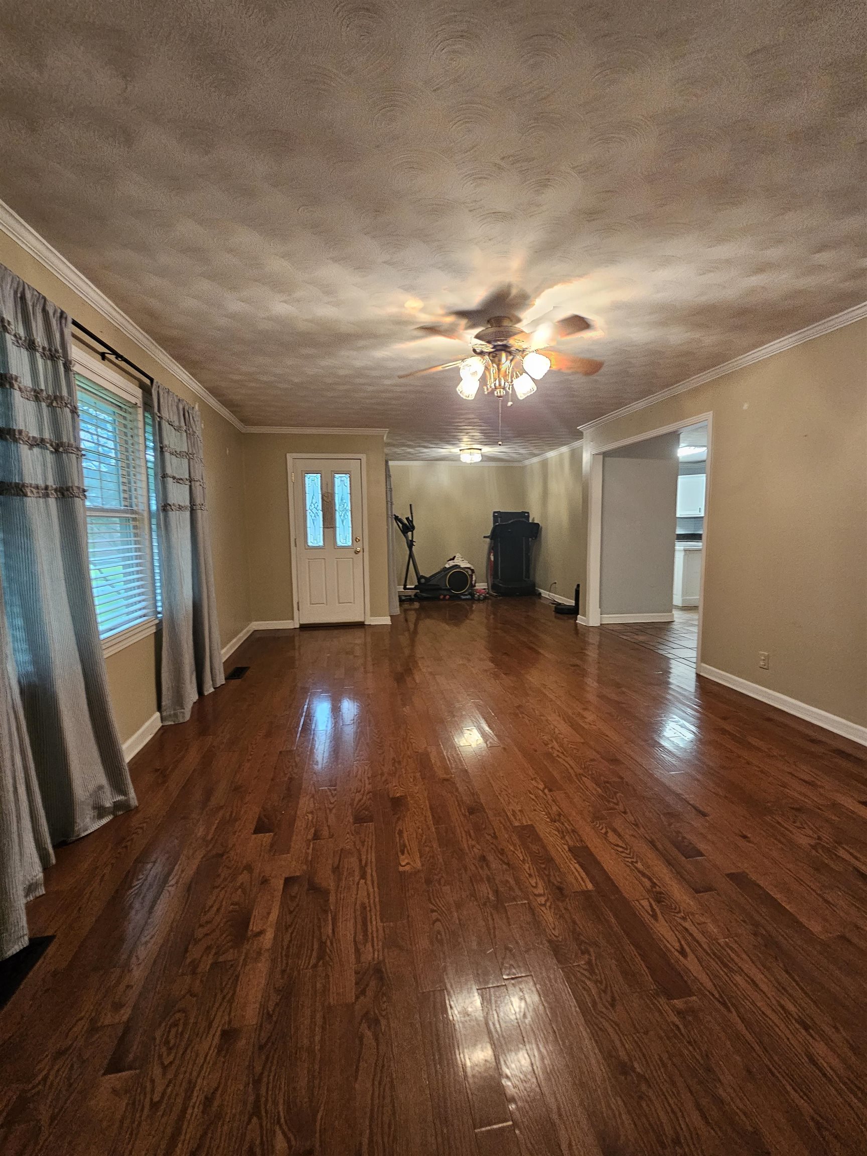 113 Smith Drive Ripley, TN 38063 - Photo 8 of 39 a view of empty room with wooden floor
