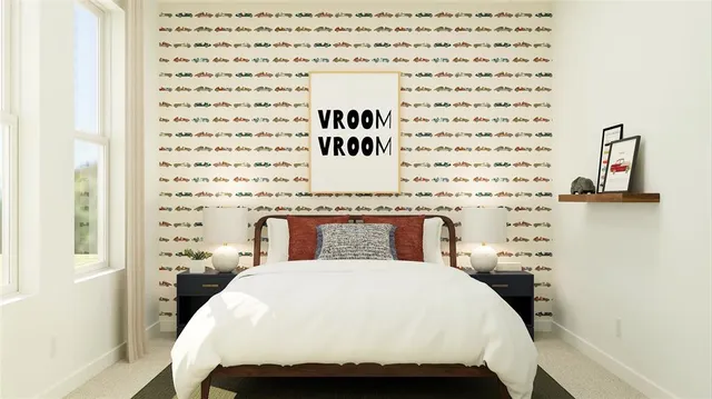 a bedroom with a large bed and a potted plant