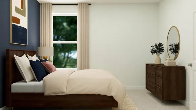 a bedroom with a bed and dresser