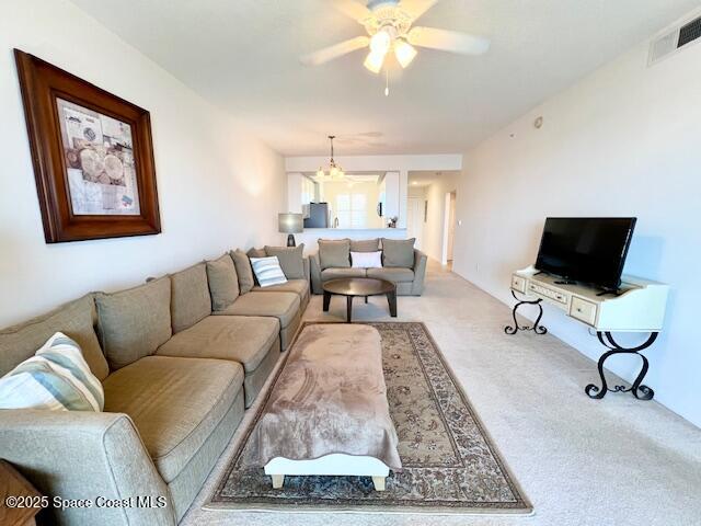 6828 Toland Drive, Unit 205 Melbourne, FL 32940 - Photo 11 of 26 a living room with furniture and a flat screen tv